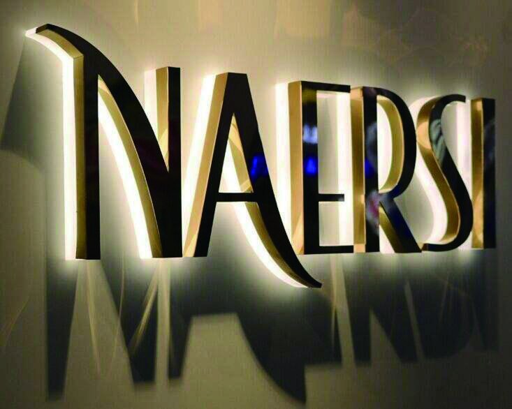 Warm halo-lit dimensional letters with metallic faces